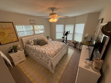 This beautifully updated stucco home is located only steps to on Del Tura Golf and Country Club in Florida - for sale on GolfHomes.com, golf home, golf lot