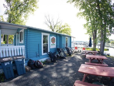 Welcome to this charming 1-bedroom, 2-bathroom seasonal cottage on Apple Island Golf Course At Apple Island Resort in Vermont - for sale on GolfHomes.com, golf home, golf lot