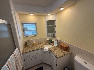 This beautifully updated stucco home is located only steps to on Del Tura Golf and Country Club in Florida - for sale on GolfHomes.com, golf home, golf lot