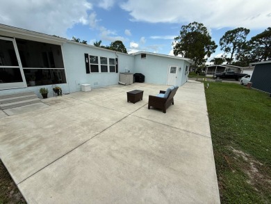 This beautifully updated stucco home is located only steps to on Del Tura Golf and Country Club in Florida - for sale on GolfHomes.com, golf home, golf lot