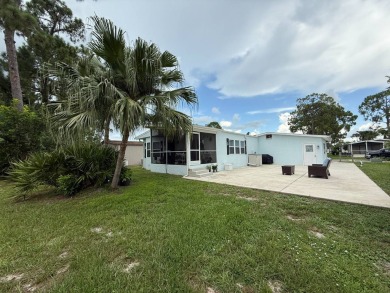 This beautifully updated stucco home is located only steps to on Del Tura Golf and Country Club in Florida - for sale on GolfHomes.com, golf home, golf lot