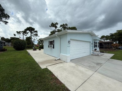 This beautifully updated stucco home is located only steps to on Del Tura Golf and Country Club in Florida - for sale on GolfHomes.com, golf home, golf lot