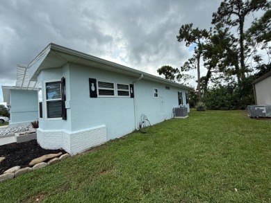This beautifully updated stucco home is located only steps to on Del Tura Golf and Country Club in Florida - for sale on GolfHomes.com, golf home, golf lot