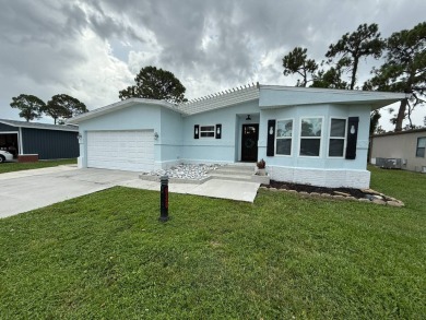 This beautifully updated stucco home is located only steps to on Del Tura Golf and Country Club in Florida - for sale on GolfHomes.com, golf home, golf lot