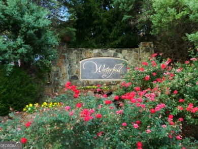 This is a stellar building lot with an amazing view of Lake on Waterfall Country Club in Georgia - for sale on GolfHomes.com, golf home, golf lot