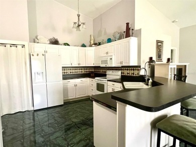 METICULOUSLY MAINTAINED 2 BEDROOM VILLA. END UNIT IN A PREMIER on Terra Ceia Golf and Country Club in Florida - for sale on GolfHomes.com, golf home, golf lot
