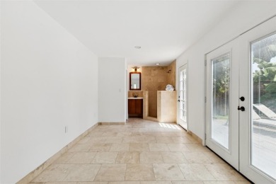 Nestled on a lush 82-ft wide lot beneath the canopy of heritage on Stevens Park Golf Course in Texas - for sale on GolfHomes.com, golf home, golf lot