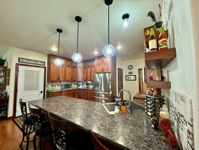Built in 2021, this three-bedroom, two-bathroom back-lot lake on Roy View Golf Course in South Dakota - for sale on GolfHomes.com, golf home, golf lot