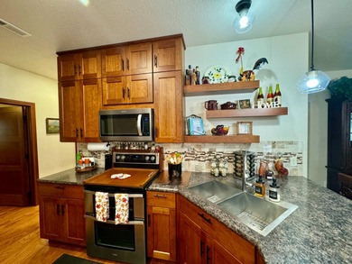 Built in 2021, this three-bedroom, two-bathroom back-lot lake on Roy View Golf Course in South Dakota - for sale on GolfHomes.com, golf home, golf lot