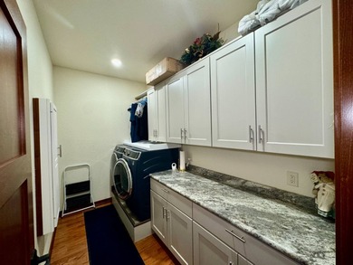 Built in 2021, this three-bedroom, two-bathroom back-lot lake on Roy View Golf Course in South Dakota - for sale on GolfHomes.com, golf home, golf lot