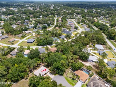 Tucked away at the end of a quiet cul-de-sac, this oversized on The Grand Club - Pine Lakes Course in Florida - for sale on GolfHomes.com, golf home, golf lot