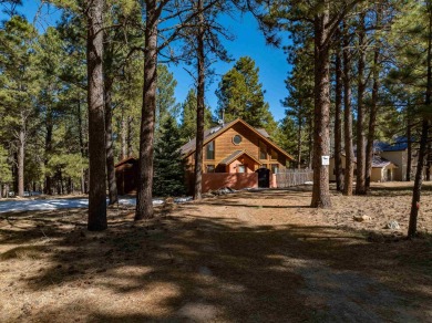 Surrounded within a serene grove of mature pine trees, this on Angel Fire Resort Country Club in New Mexico - for sale on GolfHomes.com, golf home, golf lot