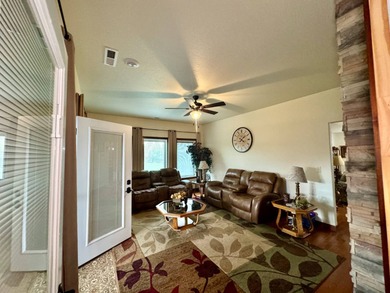 Built in 2021, this three-bedroom, two-bathroom back-lot lake on Roy View Golf Course in South Dakota - for sale on GolfHomes.com, golf home, golf lot