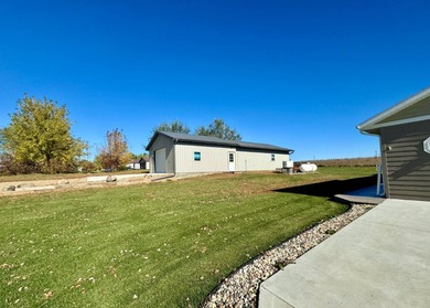 Built in 2021, this three-bedroom, two-bathroom back-lot lake on Roy View Golf Course in South Dakota - for sale on GolfHomes.com, golf home, golf lot
