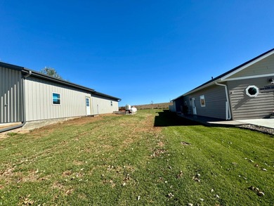 Built in 2021, this three-bedroom, two-bathroom back-lot lake on Roy View Golf Course in South Dakota - for sale on GolfHomes.com, golf home, golf lot