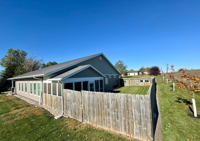 Built in 2021, this three-bedroom, two-bathroom back-lot lake on Roy View Golf Course in South Dakota - for sale on GolfHomes.com, golf home, golf lot