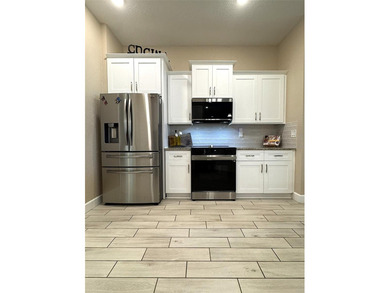 Situated within the desirable gated community of Summercrest on Baseline Golf Course in Florida - for sale on GolfHomes.com, golf home, golf lot