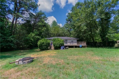 Nice one-story waterfront cottage.  Lake Caroline is on Pendleton Golf Club in Virginia - for sale on GolfHomes.com, golf home, golf lot