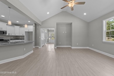 This NEW CONSTRUCTION, single level CRAFTSMAN style home is on Oyster Bay Golf Links in North Carolina - for sale on GolfHomes.com, golf home, golf lot