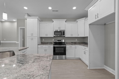 This NEW CONSTRUCTION, single level CRAFTSMAN style home is on Oyster Bay Golf Links in North Carolina - for sale on GolfHomes.com, golf home, golf lot