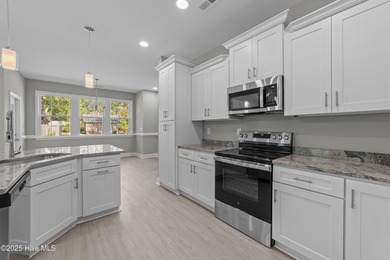 This NEW CONSTRUCTION, single level CRAFTSMAN style home is on Oyster Bay Golf Links in North Carolina - for sale on GolfHomes.com, golf home, golf lot