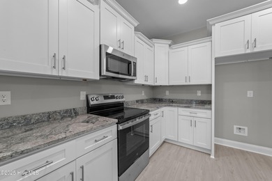 This NEW CONSTRUCTION, single level CRAFTSMAN style home is on Oyster Bay Golf Links in North Carolina - for sale on GolfHomes.com, golf home, golf lot