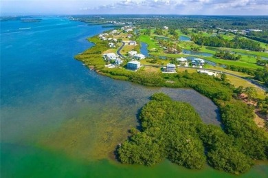 Build your dream home on a spectacular .39 acre waterfront lot on Lemon Bay Golf Club in Florida - for sale on GolfHomes.com, golf home, golf lot