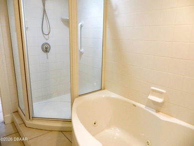 Bright open plan corner unit has TWO balconies overlooking woods on Harbour Village Golf and Yacht Club in Florida - for sale on GolfHomes.com, golf home, golf lot