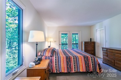 On the 12th hole of the acclaimed Connestee Falls golf course on Connestee Falls Golf Club in North Carolina - for sale on GolfHomes.com, golf home, golf lot