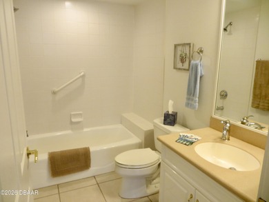 Bright open plan corner unit has TWO balconies overlooking woods on Harbour Village Golf and Yacht Club in Florida - for sale on GolfHomes.com, golf home, golf lot