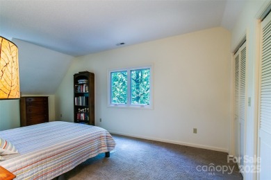 On the 12th hole of the acclaimed Connestee Falls golf course on Connestee Falls Golf Club in North Carolina - for sale on GolfHomes.com, golf home, golf lot
