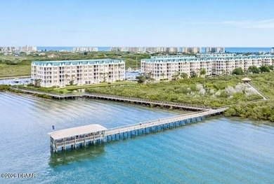 Bright open plan corner unit has TWO balconies overlooking woods on Harbour Village Golf and Yacht Club in Florida - for sale on GolfHomes.com, golf home, golf lot