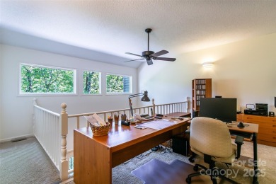 On the 12th hole of the acclaimed Connestee Falls golf course on Connestee Falls Golf Club in North Carolina - for sale on GolfHomes.com, golf home, golf lot