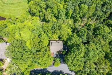 On the 12th hole of the acclaimed Connestee Falls golf course on Connestee Falls Golf Club in North Carolina - for sale on GolfHomes.com, golf home, golf lot