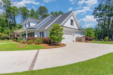 Step into the lap of luxury in this stunning 4-bedroom on Pawleys Plantation Golf and Country Club in South Carolina - for sale on GolfHomes.com, golf home, golf lot