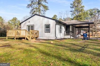 We are HOME!  Enjoy the front yard, sit on the new back deck, or on Alfred Tup Holmes Golf Course in Georgia - for sale on GolfHomes.com, golf home, golf lot