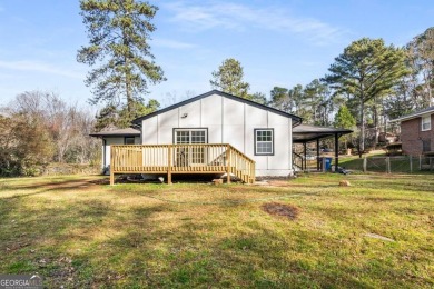 We are HOME!  Enjoy the front yard, sit on the new back deck, or on Alfred Tup Holmes Golf Course in Georgia - for sale on GolfHomes.com, golf home, golf lot