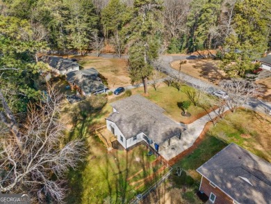 We are HOME!  Enjoy the front yard, sit on the new back deck, or on Alfred Tup Holmes Golf Course in Georgia - for sale on GolfHomes.com, golf home, golf lot