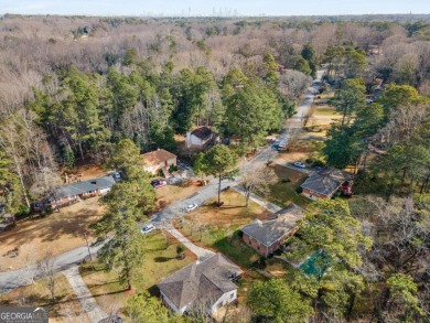 We are HOME!  Enjoy the front yard, sit on the new back deck, or on Alfred Tup Holmes Golf Course in Georgia - for sale on GolfHomes.com, golf home, golf lot