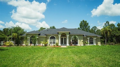 This stunning,  4-bedroom, 3-bathroom pool home boasts a light on Wedgefield Golf Club in Florida - for sale on GolfHomes.com, golf home, golf lot