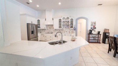 This stunning,  4-bedroom, 3-bathroom pool home boasts a light on Wedgefield Golf Club in Florida - for sale on GolfHomes.com, golf home, golf lot
