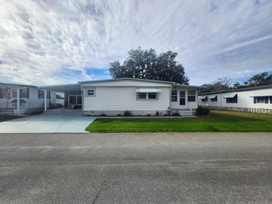 Shines bright like a diamond! Behind the beautiful glass entry on Grasslands Golf and Country Club in Florida - for sale on GolfHomes.com, golf home, golf lot