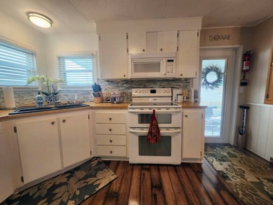 Shines bright like a diamond! Behind the beautiful glass entry on Grasslands Golf and Country Club in Florida - for sale on GolfHomes.com, golf home, golf lot