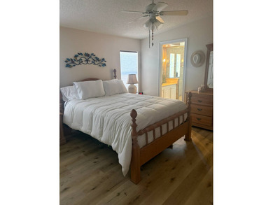 So much to love in this beautifully furnished 3-bed, 2-bath home on Sabal Springs Golf and Racquet Club in Florida - for sale on GolfHomes.com, golf home, golf lot