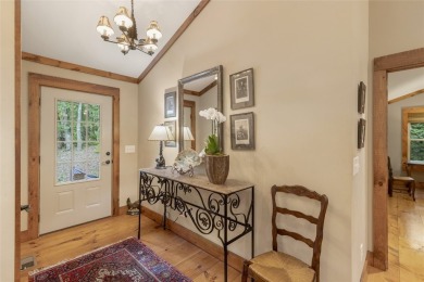 Enjoy an inviting three-bedroom, two-bathroom Arts and Crafts on Sapphire National Golf Club in North Carolina - for sale on GolfHomes.com, golf home, golf lot