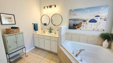 From the moment you step inside this sun-filled end-unit on Belvedere Country Club in North Carolina - for sale on GolfHomes.com, golf home, golf lot