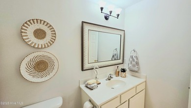 From the moment you step inside this sun-filled end-unit on Belvedere Country Club in North Carolina - for sale on GolfHomes.com, golf home, golf lot