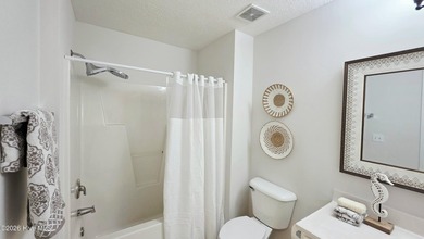 From the moment you step inside this sun-filled end-unit on Belvedere Country Club in North Carolina - for sale on GolfHomes.com, golf home, golf lot