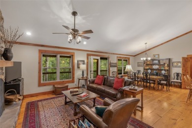 Enjoy an inviting three-bedroom, two-bathroom Arts and Crafts on Sapphire National Golf Club in North Carolina - for sale on GolfHomes.com, golf home, golf lot