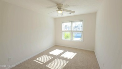 From the moment you step inside this sun-filled end-unit on Belvedere Country Club in North Carolina - for sale on GolfHomes.com, golf home, golf lot